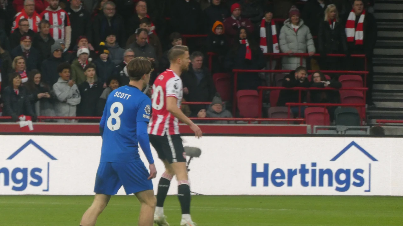 Alex Scott playing for Bournemouth in a blue away shirt